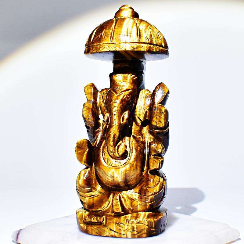 gemsmore:Artisian Hand Carved Golden Tiger Eye Ganesha With Throne