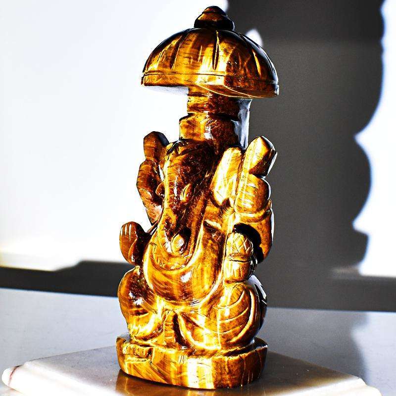 gemsmore:Artisian Hand Carved Golden Tiger Eye Ganesha With Throne