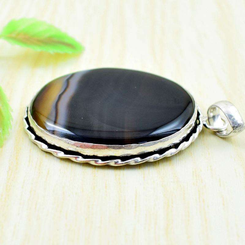 gemsmore:Natural Black Onyx Oval Shape Tibet Silver Pendant